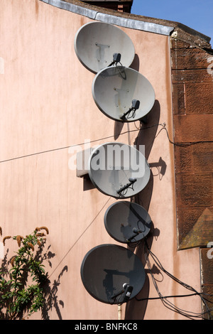 Satellite dish dishes on side of a terrace house in ...