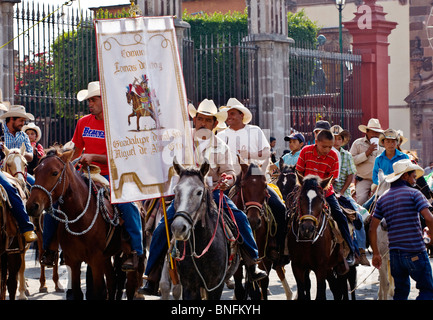 MEXICAN COWBOYS ride into town to start the annual INDEPENDENCE DAY PARADE in September - SAN MIGUEL DE ALLENDE, MEXICO Stock Photo