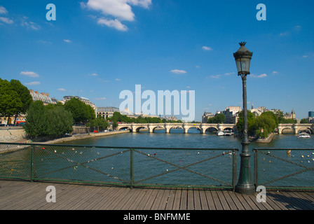 View towards Ile de la Cite island from Pont des Arts bridge central Paris France Europe Stock Photo