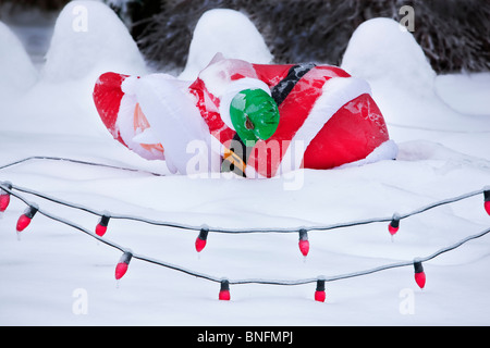 Santa fallen down in snow storm. Stock Photo