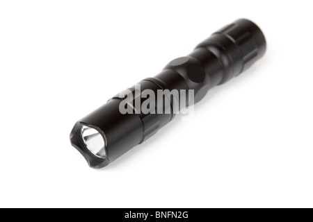 Black LED tactical flashlight isolated on white background. Stock Photo