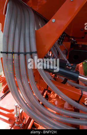 Feeding tubes on an agricultural cultivator. Stock Photo