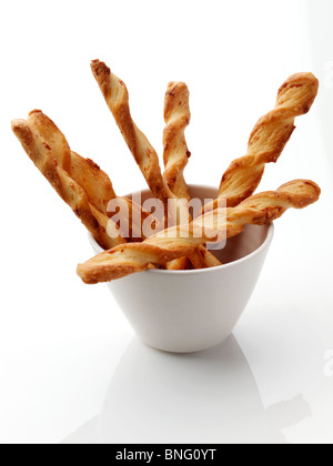 Cheese twists straws on a white background Stock Photo