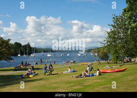 People relaxing at Fell Foot Park, on the shore of Lake Windermere, Lake District National Park, Cumbria, England UK