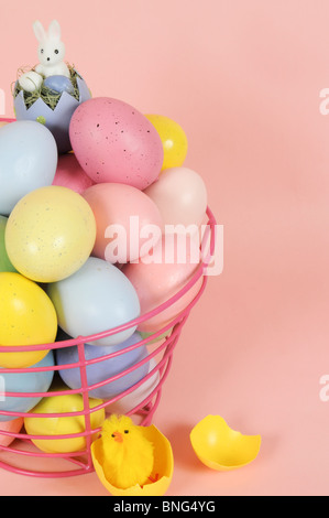 Easter Eggs in Pink Wire Basket Stock Photo