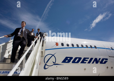 Media descend steps of the Boeing-manufactured 787 Dreamliner (N787BX) at the Farnborough Airshow. Stock Photo