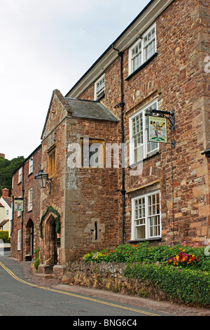 The historic ancient Luttrell Arms Hotel in the main street of the town of Dunster in Somerset Stock Photo