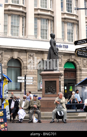 Elderly men taking a rest in next to the Sister Dora Statue Walsall West Midlands England Uk Stock Photo