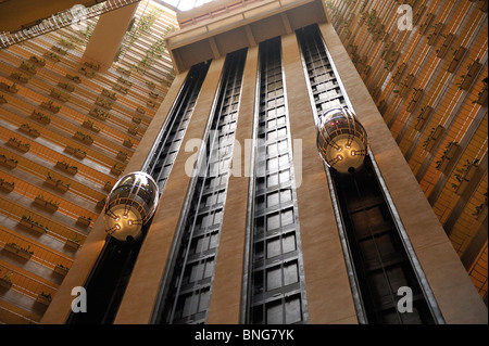 The glass atrium elevators of the Pan Pacific Hotel in Singapore Stock Photo