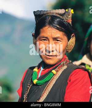 Sherpa woman wearing her best finery at a festival in the village of Seduwa in east Nepal Stock Photo