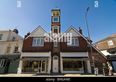 Horizontal wide angle of distinctive double fronted architecture with a clock tower on Wimbledon High Street in the sunshine Stock Photo