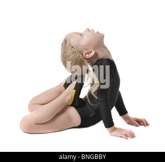little gymnast girl doing exercise isolated on white Stock Photo