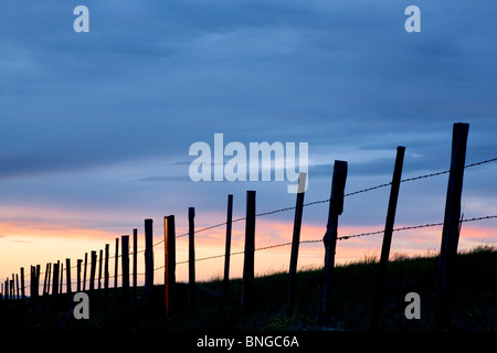 Fence in Wallowa County, Oregon at sunset. Stock Photo
