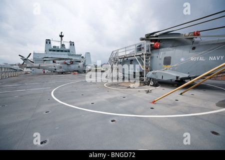 A Royal Navy EH-101 Merlin helicopter inside the hangar of RFA FORT ...