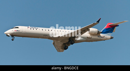 A Delta Connection (SkyWest Airlines) CRJ-702 regional passenger jet landing at Vancouver International Airport. Stock Photo