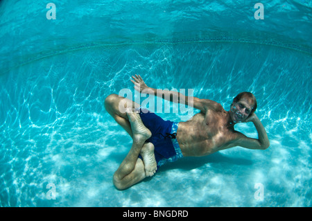 Man doing yoga underwater in pool, Kauai, Hawaii Stock Photo - Alamy