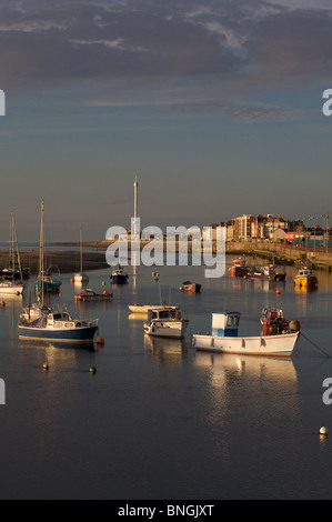 Boats moored in Foryd Harbour, Rhyl at the mouth of the River Clwyd; in the background Rhyl Sky Tower. Stock Photo