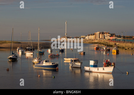 Boats moored in Foryd Harbour, Rhyl at the mouth of the River Clwyd; in the background Rhyl Sky Tower. Stock Photo