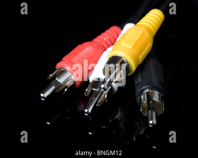 Closeup of component audio and video cables on a dark background. Stock Photo