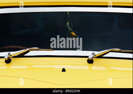 Sunglasses hanging from the rear view mirror of a yellow Ford pop drag car at the Santa Pod Retro Show 2010 Stock Photo