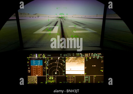 Glowing simulator cockpit instrumentation of a Lockheed Martin F-35 Lightning II stealth fighter. Stock Photo