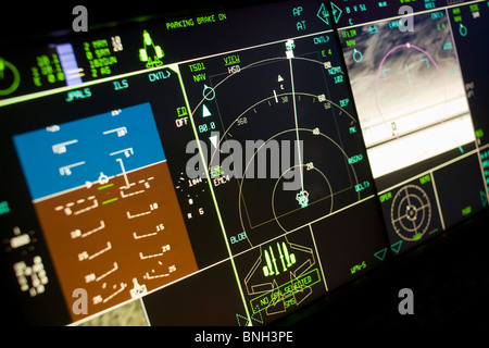 Glowing simulator cockpit instrumentation of a Lockheed Martin F-35 Lightning II stealth fighter. Stock Photo