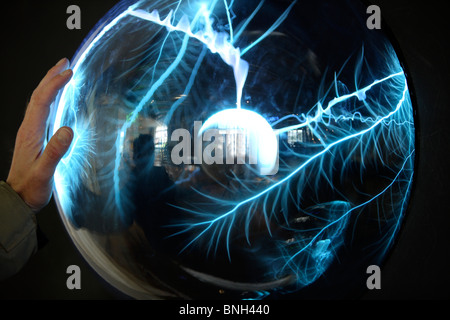Plasma lamp, lightning ball. Generates artificial flashes in a glass ball. Stock Photo