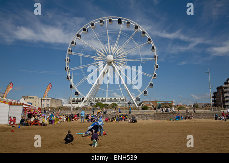 Ferris Wheel and beach cafe at Weston-Super-Mare,  North Somerset, UK Stock Photo