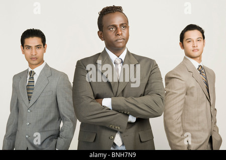Three businessmen standing together Stock Photo