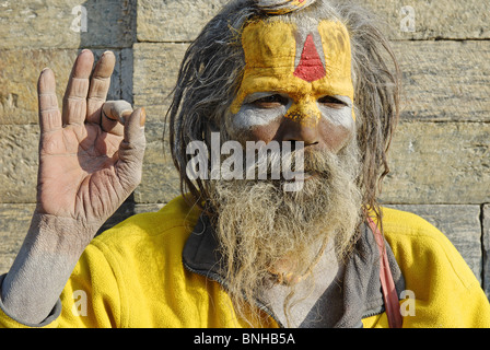 Sadhu holy man Pashupatinath Katmandu Nepal Himalayas Asia Asian asceticism ascetic ascetically beard whiskers painted face Stock Photo