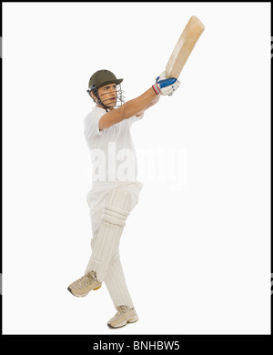 Cricket batsman playing a hook shot Stock Photo