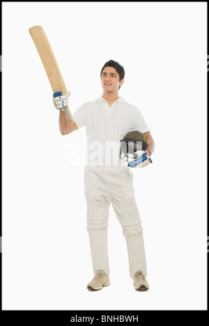 Cricket batsman celebrating his success Stock Photo