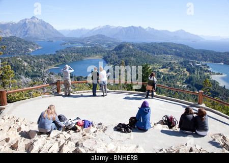 People enjoying the views of the lake district from Cerro Campanaro, outside of Bariloche, Aregentina Stock Photo