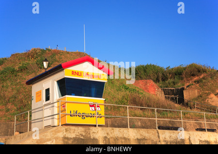 RNLI lifeguard hut on the sea wall at East Runton Gap, Norfolk, England, United Kingdom. Stock Photo