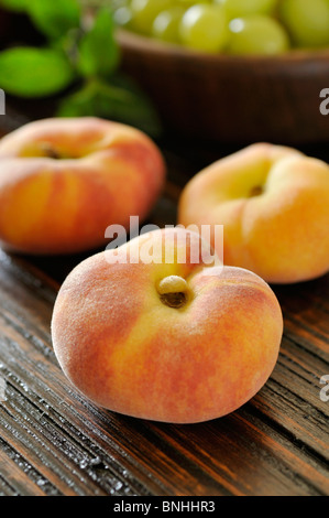 Flat peach (Prunus persica var. platycarpa) Stock Photo