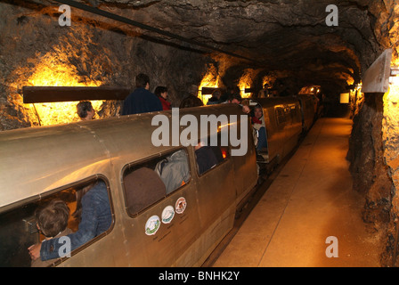 Switzerland Bex Salt mine mines underground indoors inside industry train tourists people tunnel Canton of vaud Stock Photo