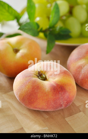 Flat peach (Prunus persica var. platycarpa) Stock Photo