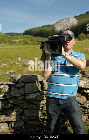 Video cameraman making a television programme, Wales UK Stock Photo