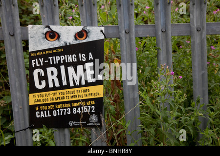 no fly tipping sign on railings. Stock Photo