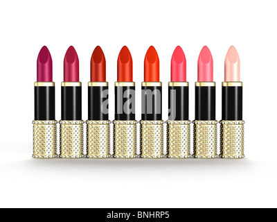 A palette of luxury lipstick tubes of colors ranging from purple, red to pink isolated objects on white background Stock Photo
