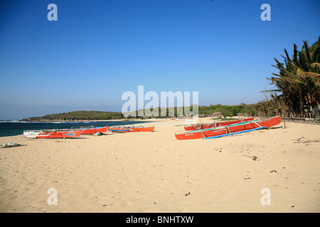 Philippines Asia Luzon Ilocos Norte island the north Bangui Bay beach seashore Burgos boats red coast ocean sea shore Stock Photo