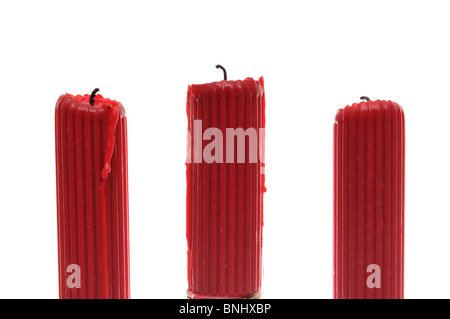 Three red candles isolated on white Stock Photo