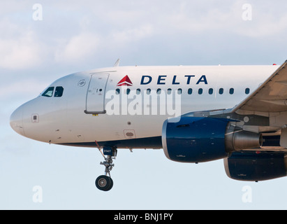 A Delta Air Lines Airbus A319 (A319-114) commercial jet airliner on final approach for landing . Stock Photo