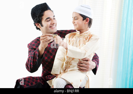 Muslim father and son Stock Photo