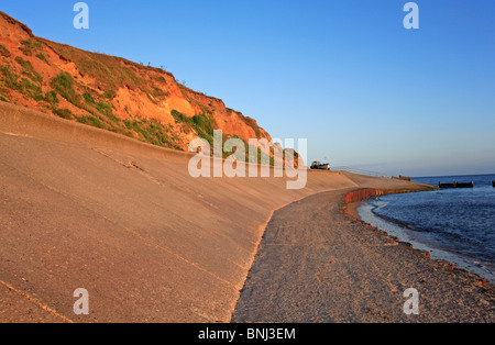 Concrete sea wall and skirt protecting cliffs and beach access from erosion at West Runton, Norfolk, England, United Kingdom. Stock Photo