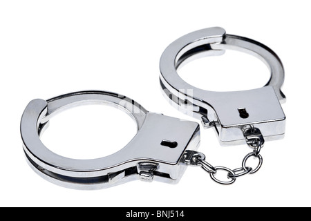 Photo of a pair of handcuffs isolated on a white background Stock Photo