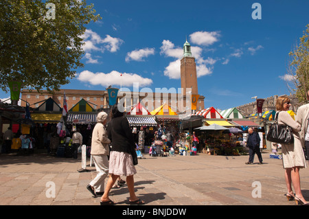The outdoor Market with shoppers in the summer in Norwich , Norfolk , England , Great Britain , Uk Stock Photo