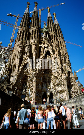 Group of foreign tourists outside Antoni Gaudi's Temple Expiatori de la Sagrada Família in Barcelona. Stock Photo