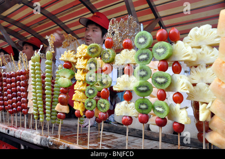 Fruit for sale in Donganmen Street night food market, Beijing, China Stock Photo