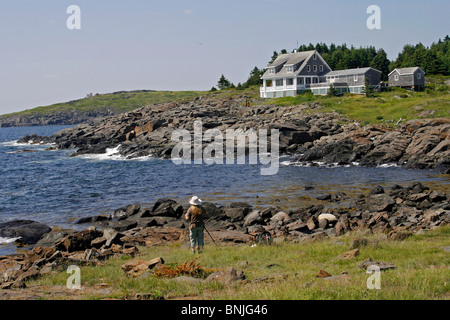 Maine coast Monhegan Island artist colony New England USA remote offshore granite rocky coast artist painting Stock Photo